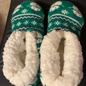 1 size ten girl’s pjs. 2 cute slippers green & fluffy. 1 girls pj pants.